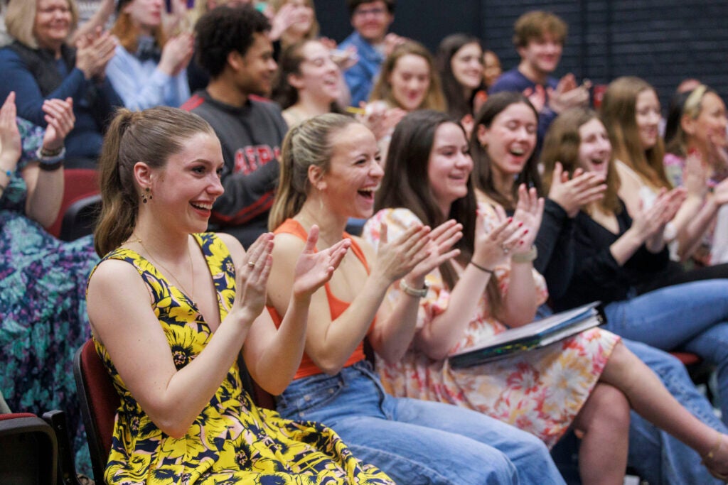 Students clapping in audience