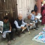 men reading in Nepal