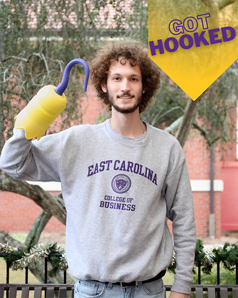 male student holding a 3D printed hook