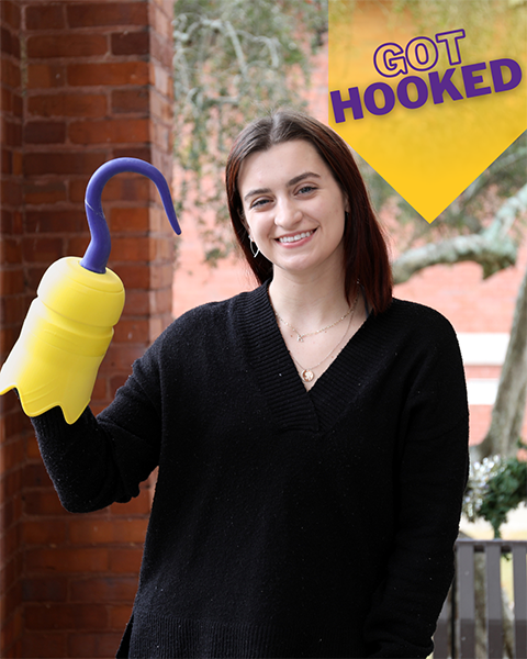 female student holding 3D printed hook