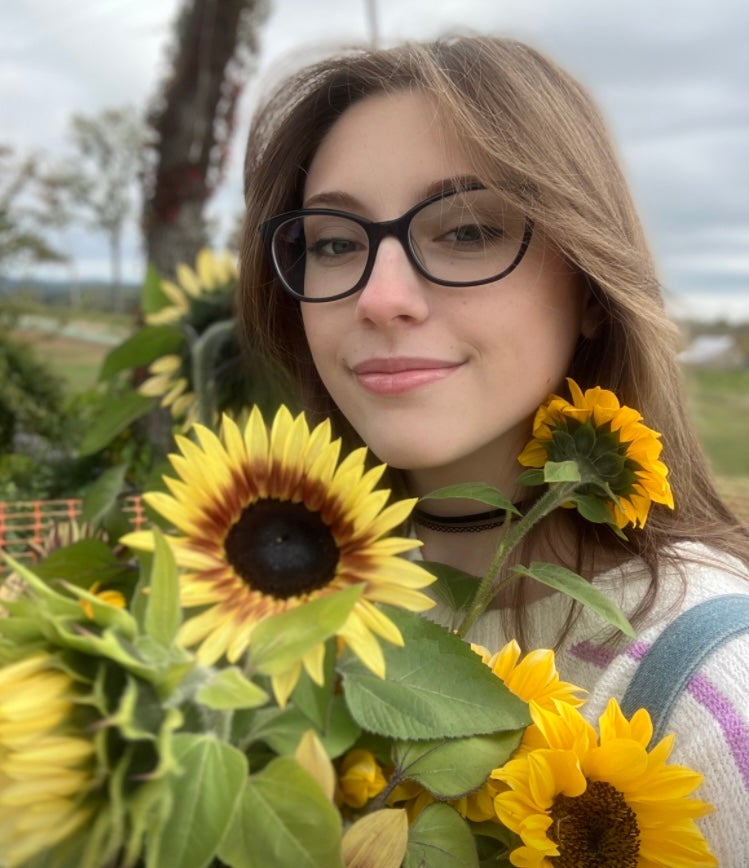 photo of Aydan Lawler in sunflower field