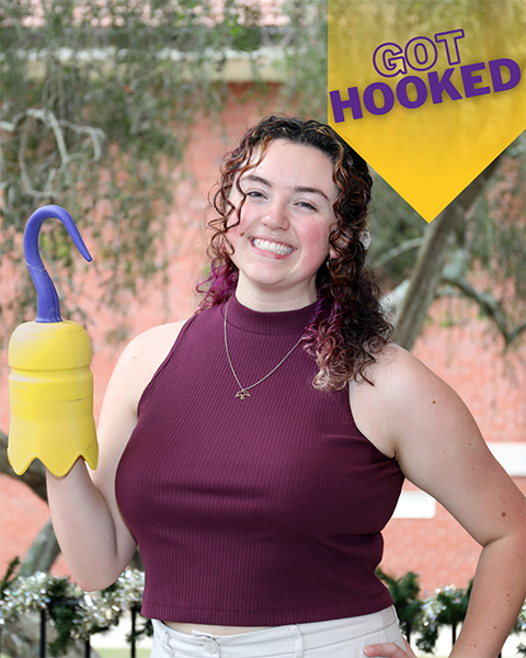 female student holding a 3D printed hook