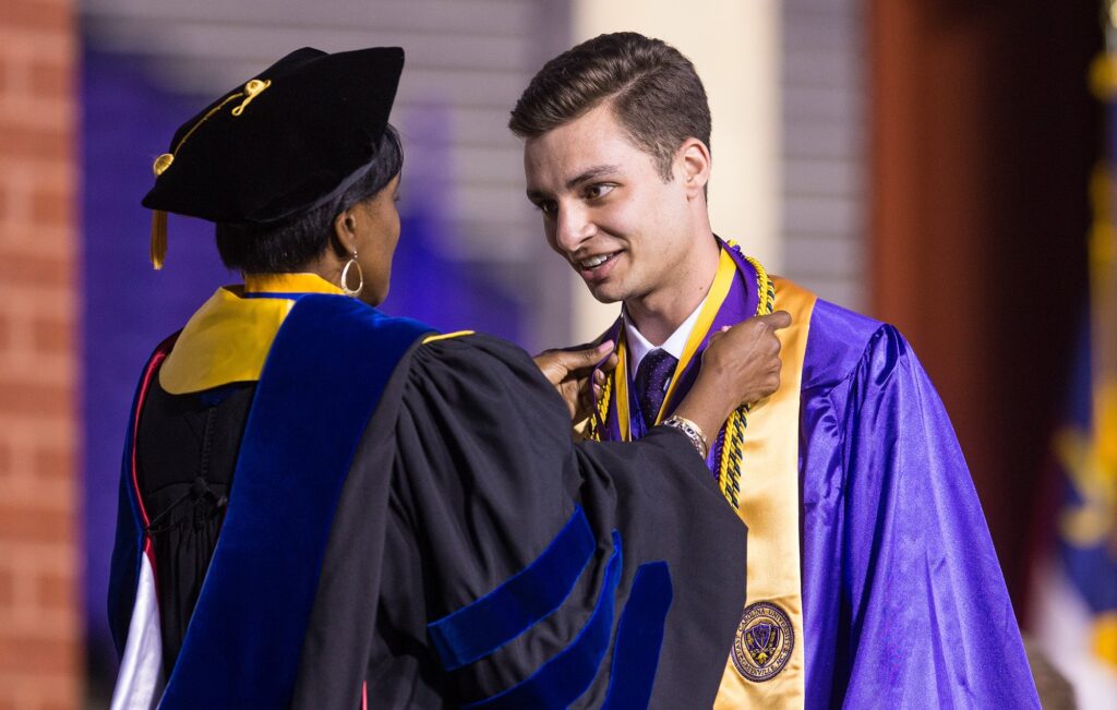 Will Zahran, pictured here receiving the Robert Wright Award at the 2018 ECU Commencement, was named one of four Presidential Scholars by UNC System President Margaret Spellings for the 2018-2019 school year.