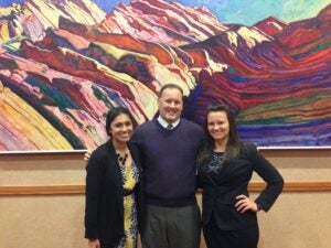 Shayna Mooney, Associate Dean Kevin Baxter, and Adrian Modzik before presenting