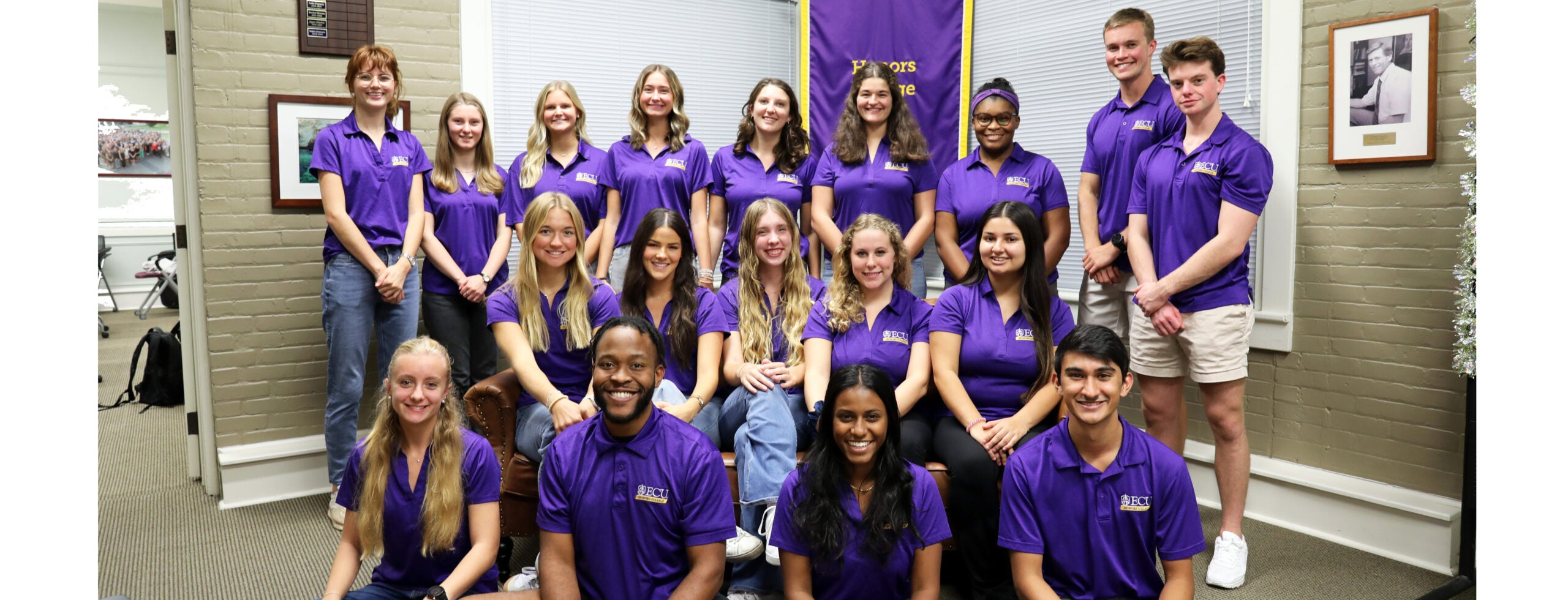 group of students standing and sitting for ambassadors photo